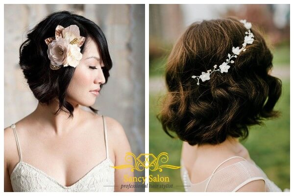 Các cô dâu có thể cài thêm đóa hoa to, hoặc bờm hoa nhỏ cho mái tóc uốn xoăn sóng được tết thêm của mình.